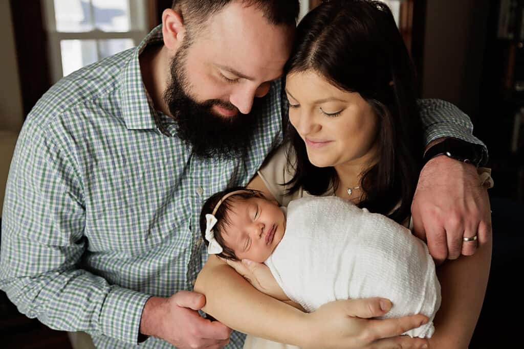 Newborn Portrait - mother and father holding baby