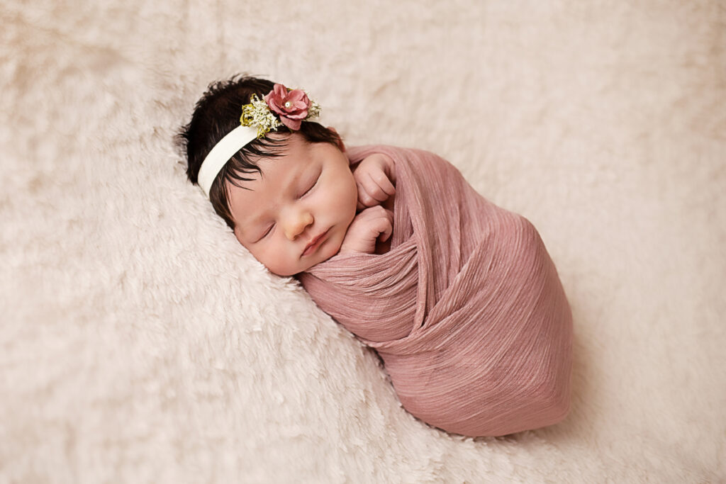 Newborn Portrait in pink wrap