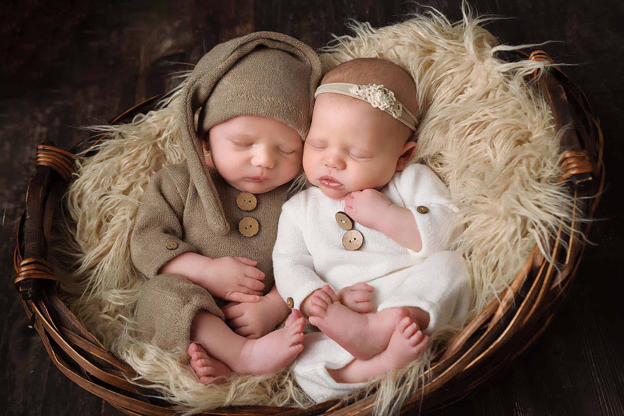 NH Newborn Twin Portrait. Boy in brown knit romper and girl in ivory knit romper.