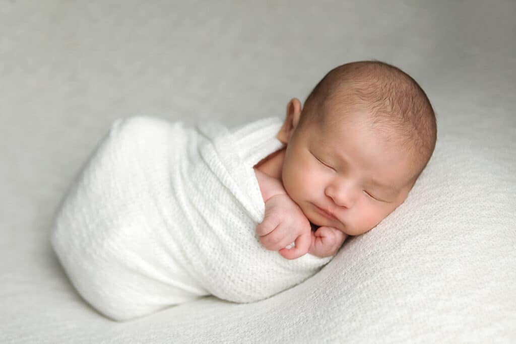 Boston Newborn Portrait of baby boy. Sleeping with hands under chin.