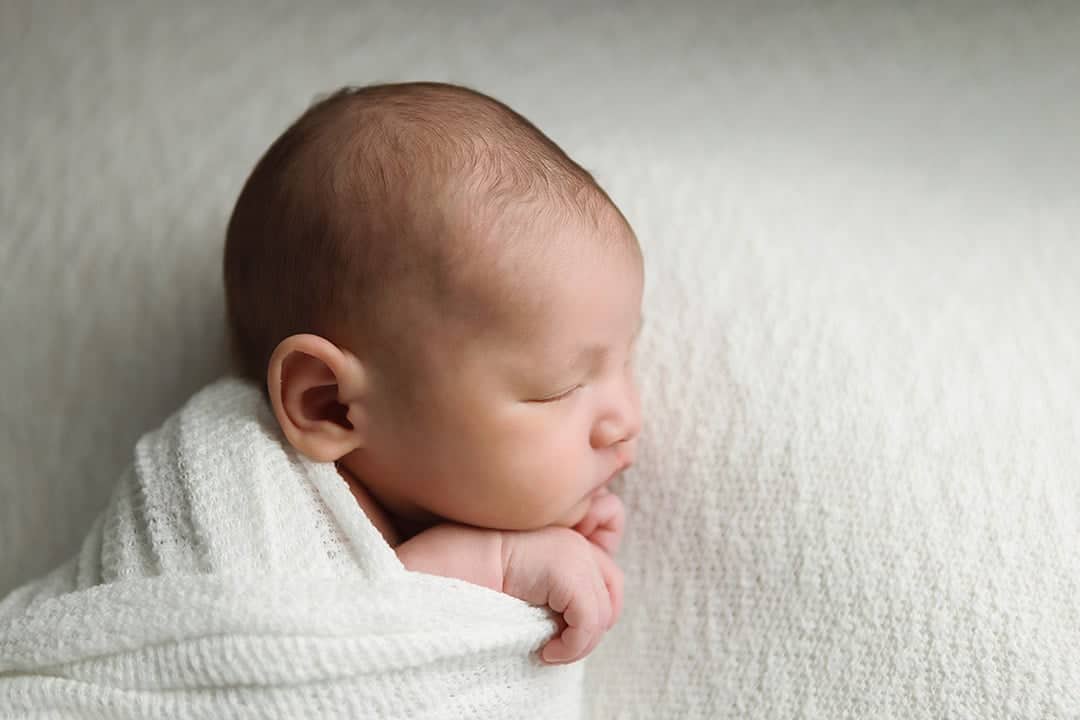 Windham NH Newborn Portrait of baby boy side profile.