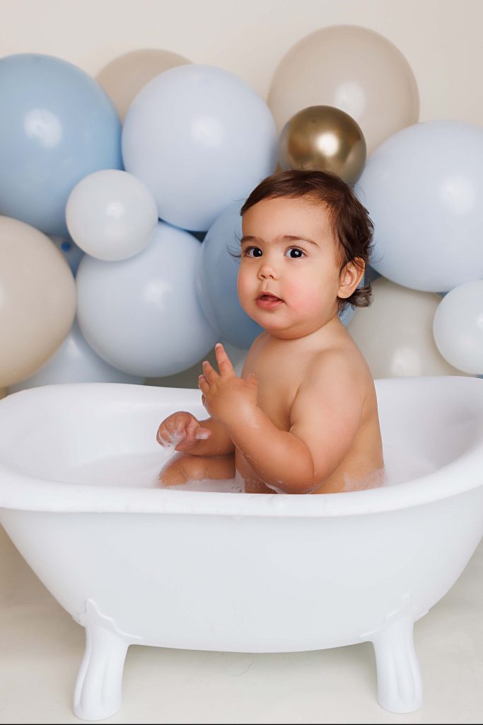 One Year old in tub for cake smash portrait.