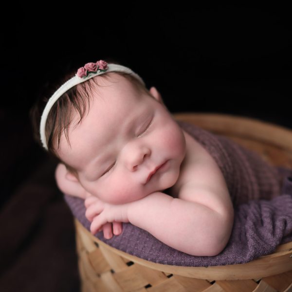 Boston Newborn portrait of baby girl sleeping in basket.