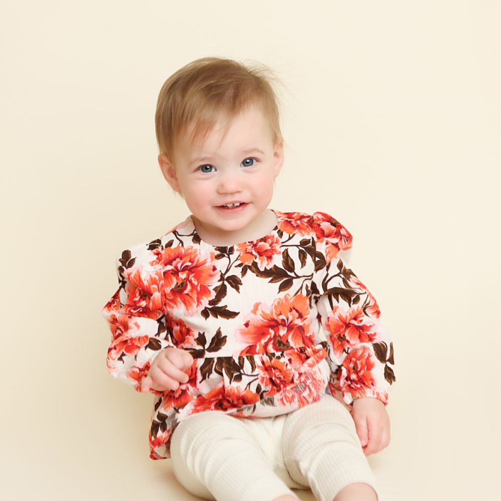 NH One Year Session of little girl in floral shirt.