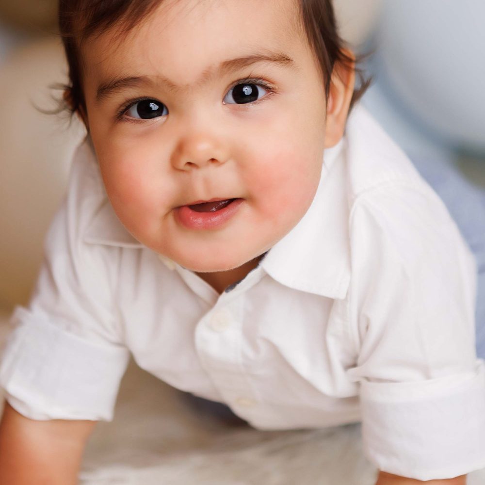 Boston One year old close up crawling towards camera.